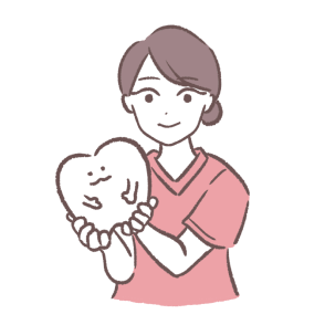 歯を持っている歯科助手