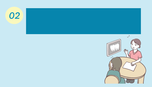 患者に説明する歯科助手